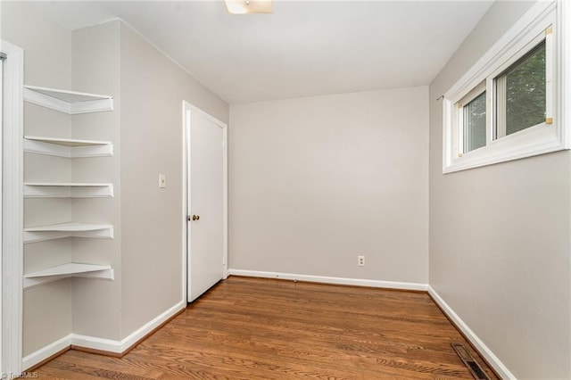 1705 Boyden St, Greensboro, NC 27403 - unfurnished bedroom with baseboards and wood finished floors