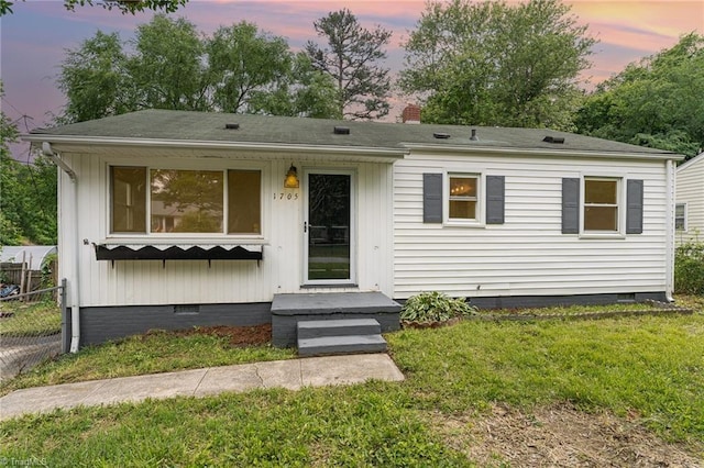 1705 Boyden St, Greensboro, NC 27403 - view of front of house with crawl space, a chimney, and roof with shingles