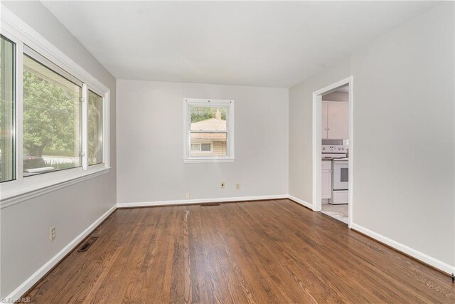 1705 Boyden St, Greensboro, NC 27403 - empty room featuring wood finished floors and baseboards