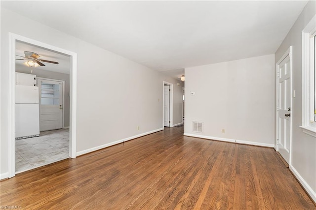 1705 Boyden St, Greensboro, NC 27403 - empty room with wood finished floors, ceiling fan, and baseboards