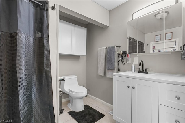 bathroom with a shower with curtain, tile patterned floors, baseboards, vanity, and toilet