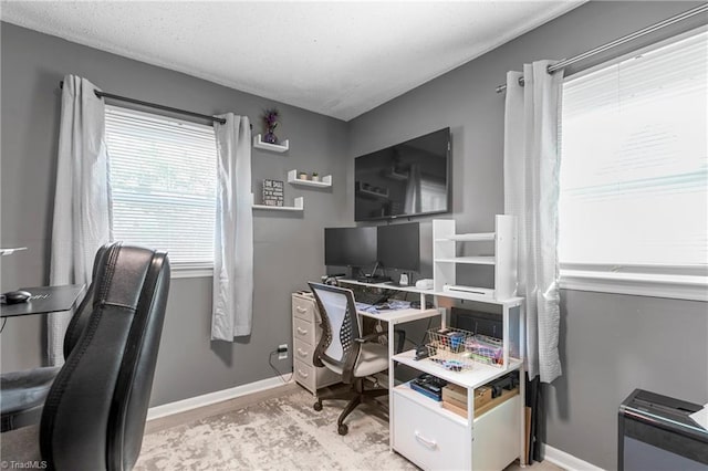 office space with baseboards