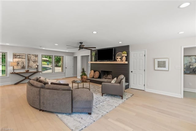 135 Boxwood Cir, Advance, NC 27006 - living area featuring a ceiling fan, baseboards, a large fireplace, recessed lighting, and light wood finished floors