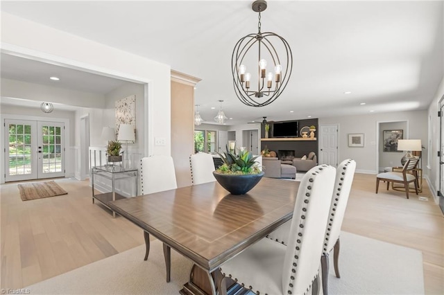 135 Boxwood Cir, Advance, NC 27006 - dining area featuring french doors, a chandelier, light wood-type flooring, recessed lighting, and baseboards