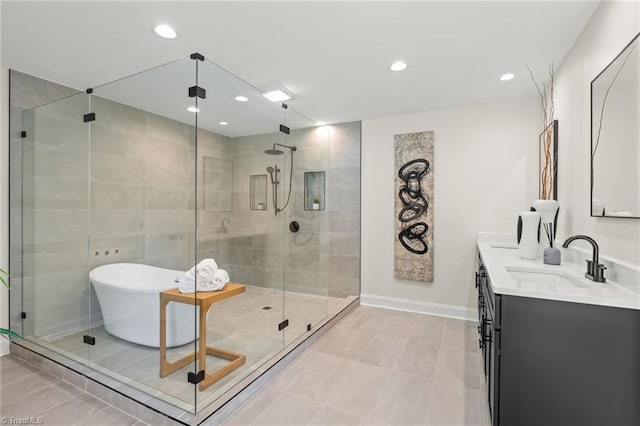 135 Boxwood Cir, Advance, NC 27006 - bathroom featuring double vanity, a freestanding bath, a shower stall, recessed lighting, and tile patterned floors