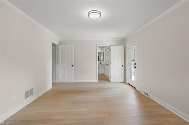 135 Boxwood Cir, Advance, NC 27006 - unfurnished room with crown molding, light wood-style floors, and baseboards