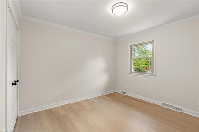 135 Boxwood Cir, Advance, NC 27006 - unfurnished room featuring light wood-style floors, baseboards, and ornamental molding