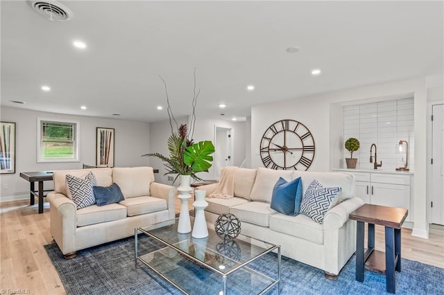 135 Boxwood Cir, Advance, NC 27006 - living area featuring light wood-style flooring, recessed lighting, and baseboards