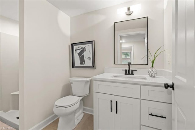 135 Boxwood Cir, Advance, NC 27006 - bathroom with toilet, vanity, baseboards, and a shower