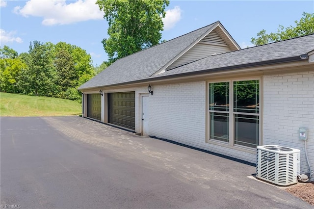 135 Boxwood Cir, Advance, NC 27006 - view of patio / terrace with central air condition unit and an attached garage