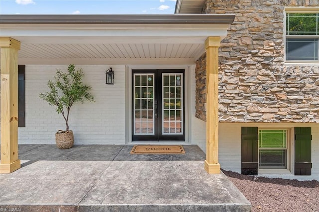 135 Boxwood Cir, Advance, NC 27006 - entrance to property featuring brick siding, stone siding, and french doors