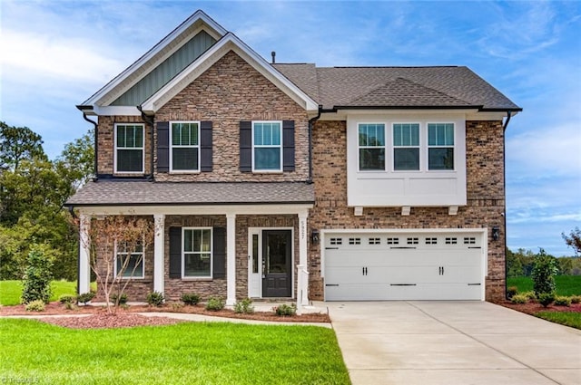 5927 Clouds Harbor Trl, Clemmons, NC 27012 - craftsman-style house with concrete driveway, a front yard, board and batten siding, an attached garage, and a shingled roof