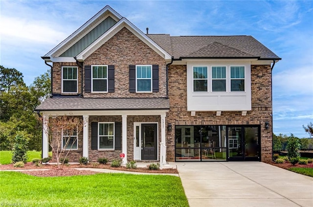 5927 Clouds Harbor Trl, Clemmons, NC 27012 - craftsman-style home featuring concrete driveway, a front lawn, board and batten siding, and a shingled roof