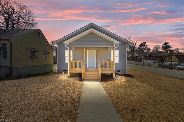 view of front facade featuring crawl space and covered porch