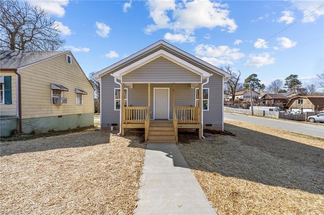 view of front of home with crawl space and a porch