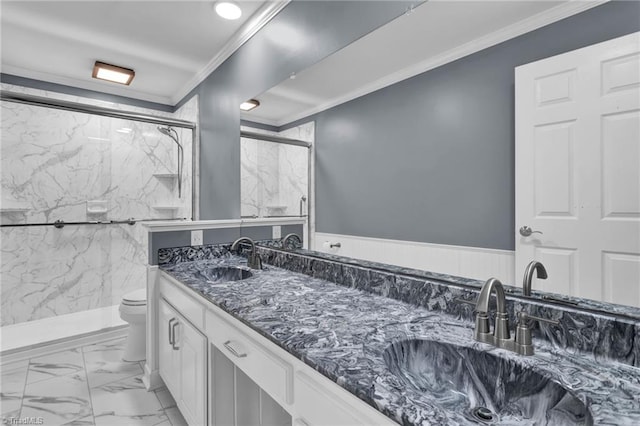 bathroom with an enclosed shower, toilet, vanity, tile walls, and ornamental molding