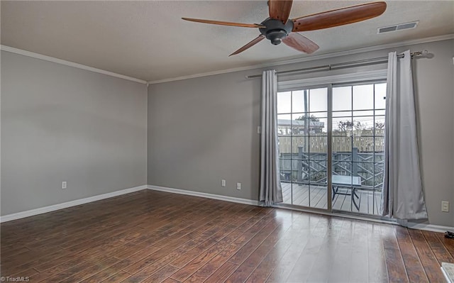 spare room with dark hardwood / wood-style floors, ceiling fan, and ornamental molding