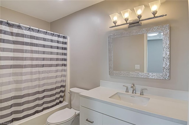 full bathroom with shower / bath combo, vanity, and toilet