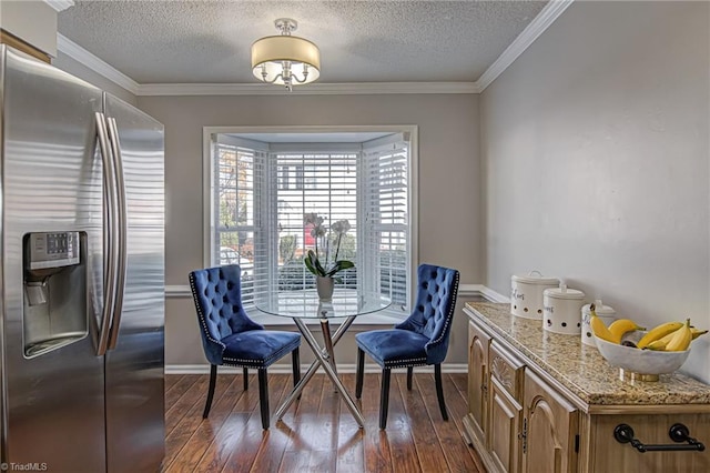 dining room featuring a textured ceiling, crown molding, and dark wood-type flooring