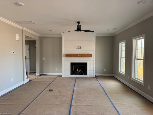 unfurnished living room featuring crown molding and baseboards