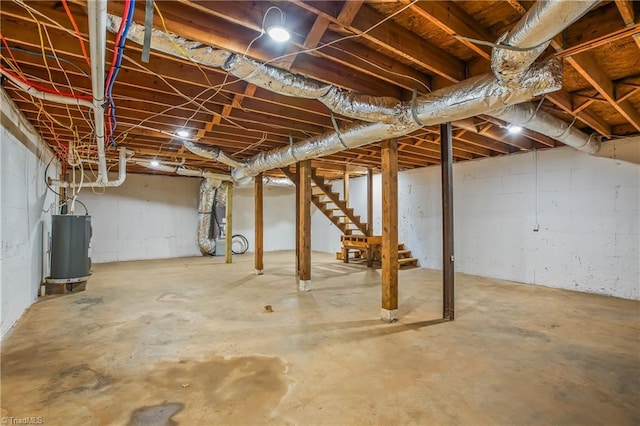 unfinished below grade area with water heater and stairs