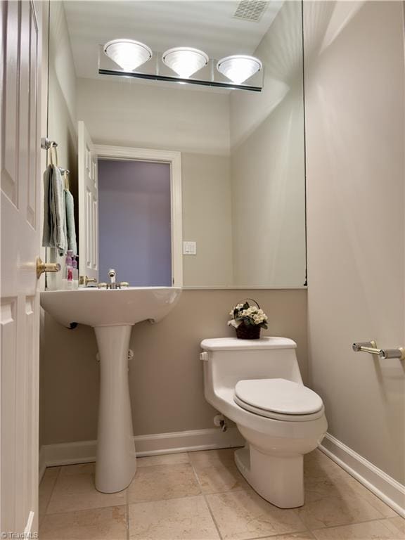 606 Dorado Cir, High Point, NC 27265 - bathroom with toilet and baseboards