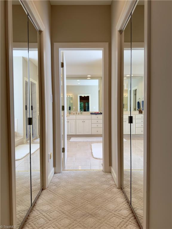 606 Dorado Cir, High Point, NC 27265 - corridor with light carpet and baseboards