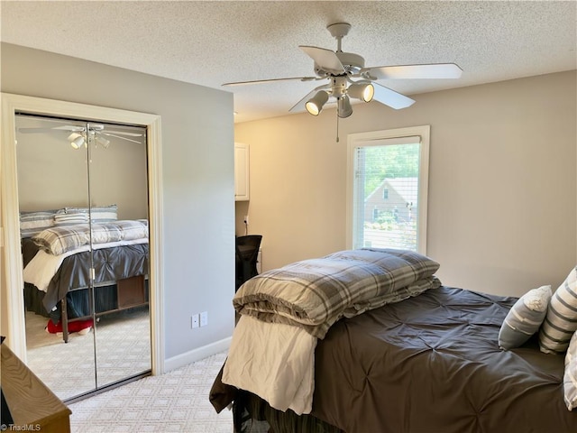 606 Dorado Cir, High Point, NC 27265 - bedroom featuring light carpet, a closet, ceiling fan, a textured ceiling, and baseboards