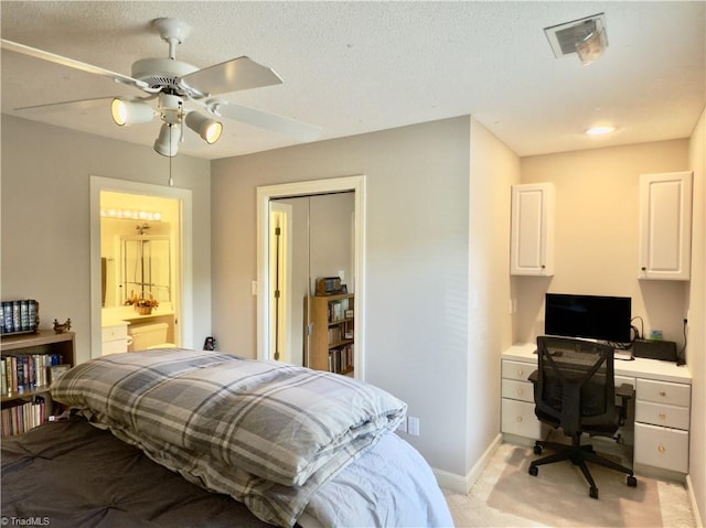 606 Dorado Cir, High Point, NC 27265 - bedroom featuring light colored carpet, an office area, baseboards, ceiling fan, and ensuite bath