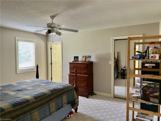 606 Dorado Cir, High Point, NC 27265 - bedroom featuring light carpet, ceiling fan, and a textured ceiling