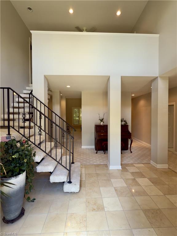606 Dorado Cir, High Point, NC 27265 - stairs featuring recessed lighting, tile patterned floors, and baseboards