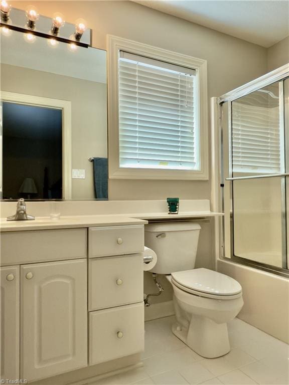 606 Dorado Cir, High Point, NC 27265 - bathroom featuring tile patterned floors, vanity, toilet, and combined bath / shower with glass door