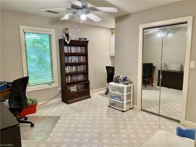 606 Dorado Cir, High Point, NC 27265 - home office with a ceiling fan, light carpet, and baseboards