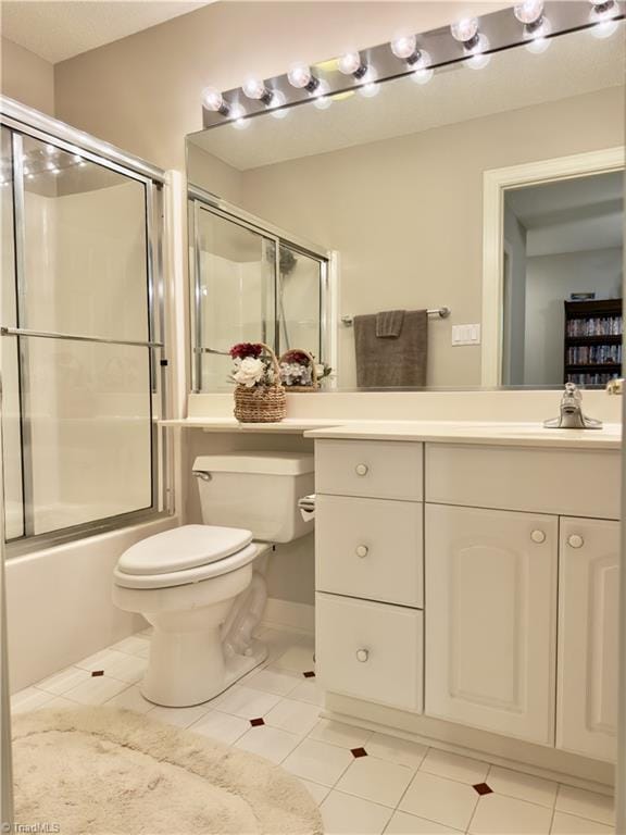 606 Dorado Cir, High Point, NC 27265 - bathroom featuring toilet, tile patterned floors, enclosed tub / shower combo, and vanity