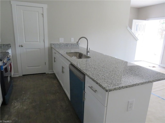 kitchen featuring kitchen peninsula, sink, stainless steel dishwasher, light stone countertops, and white cabinetry