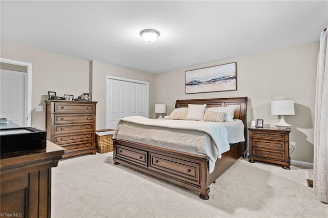 carpeted bedroom with a closet