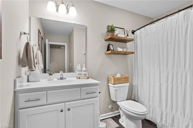 bathroom with vanity, hardwood / wood-style flooring, toilet, and a shower with curtain