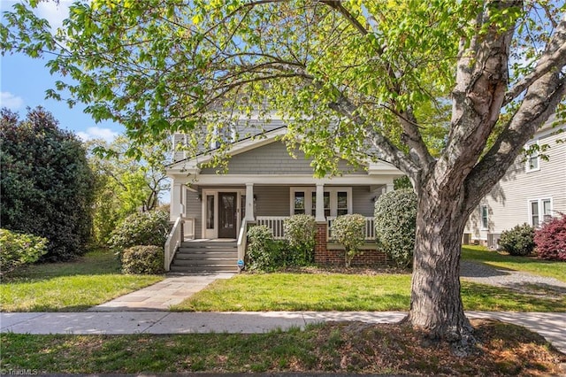 104 E Wilson St, Mebane, NC 27302 - view of front facade with a porch and a front yard