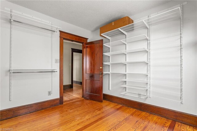 104 E Wilson St, Mebane, NC 27302 - spacious closet featuring wood finished floors