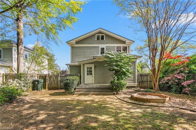 104 E Wilson St, Mebane, NC 27302 - rear view of house featuring fence
