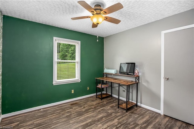 office space featuring a textured ceiling, wood finished floors, and baseboards