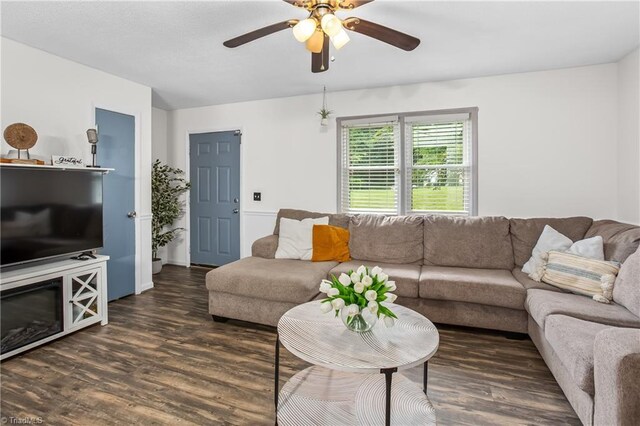 living area with ceiling fan and wood finished floors