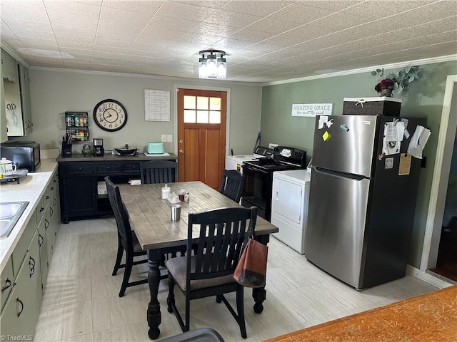 813 Blevins Store Rd, Mount Airy, NC 27030 - dining room featuring crown molding and washer / dryer