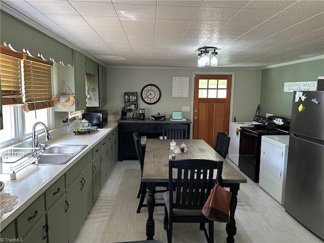 813 Blevins Store Rd, Mount Airy, NC 27030 - kitchen featuring freestanding refrigerator, a sink, washer and clothes dryer, crown molding, and black microwave