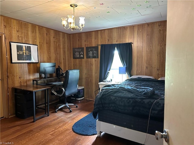 813 Blevins Store Rd, Mount Airy, NC 27030 - bedroom featuring a chandelier, wood walls, wood finished floors, and an office area