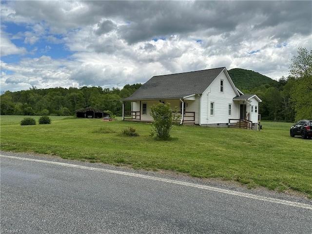 813 Blevins Store Rd, Mount Airy, NC 27030 - view of side of property featuring a lawn, crawl space, roof with shingles, and a view of trees