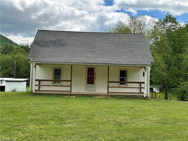 813 Blevins Store Rd, Mount Airy, NC 27030 - view of front facade featuring a front yard, covered porch, and roof with shingles