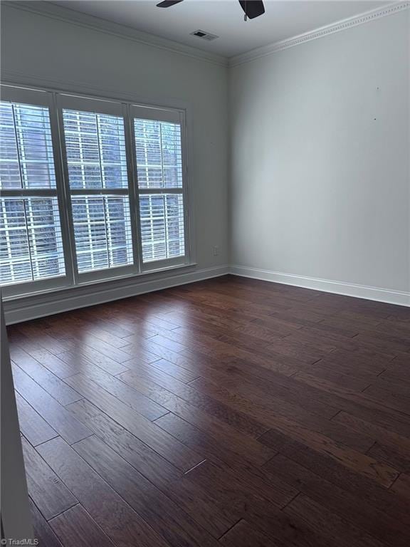 unfurnished room with crown molding, dark hardwood / wood-style floors, and ceiling fan