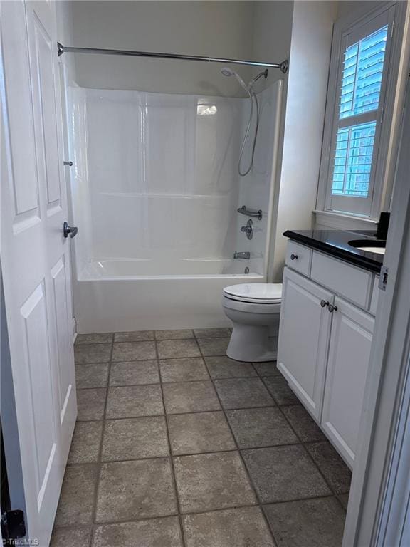 full bathroom featuring vanity, tub / shower combination, and toilet