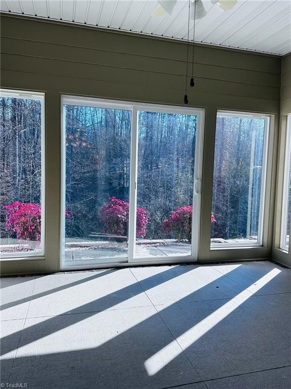 unfurnished sunroom with a wealth of natural light